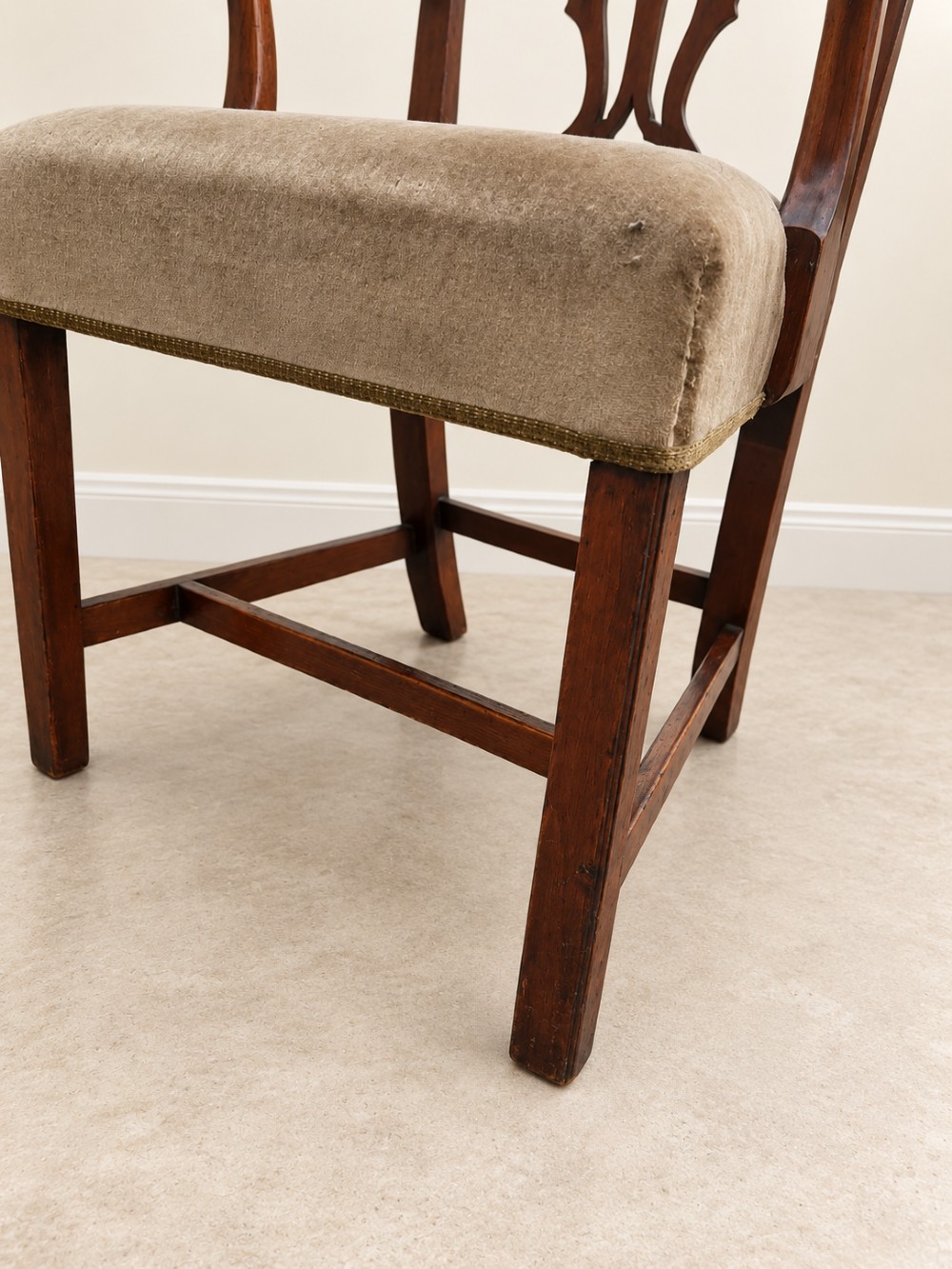 A Georgian yew wood armchair featuring a pierced back splat, curved arms, square legs with stretchers, and a neutral velvet upholstered seat. View IX