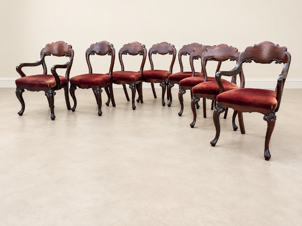 A set of eight 19th-century Victorian mahogany balloon back chairs with red velvet upholstery, including six side chairs and two carver armchairs with cabriole front legs. View IV