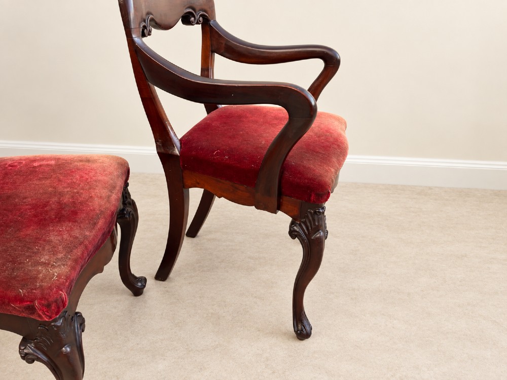 A set of eight 19th-century Victorian mahogany balloon back chairs with red velvet upholstery, including six side chairs and two carver armchairs with cabriole front legs. View VII
