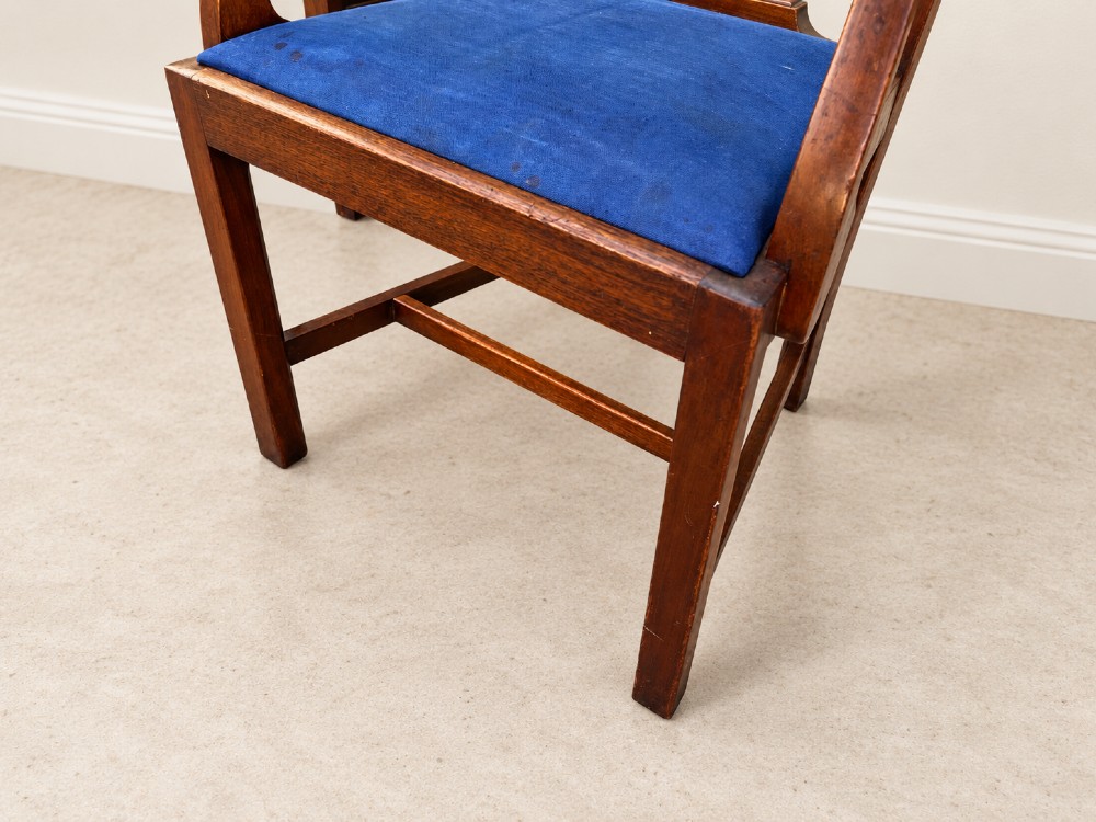 A set of six mahogany Chippendale style dining chairs comprising two carver armchairs and four side chairs with pierced fretwork backs and blue fabric drop-in seats. View VI