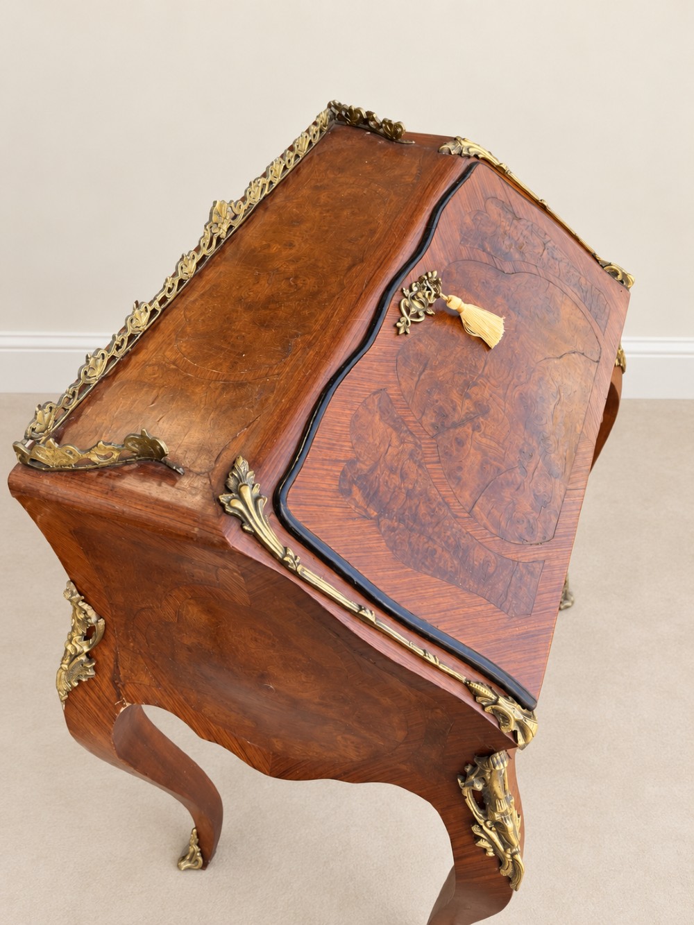 A 19th-century French Louis XV style walnut slant-front writing bureau featuring marquetry veneer, ornate gilt-bronze mounts, a brass pierced gallery, and long cabriole legs. View III
