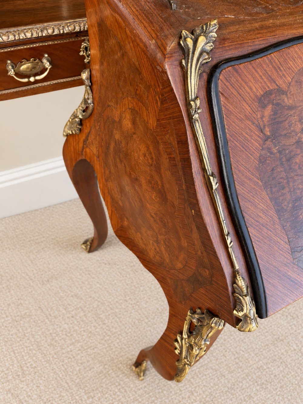 A 19th-century French Louis XV style walnut slant-front writing bureau featuring marquetry veneer, ornate gilt-bronze mounts, a brass pierced gallery, and long cabriole legs. View V