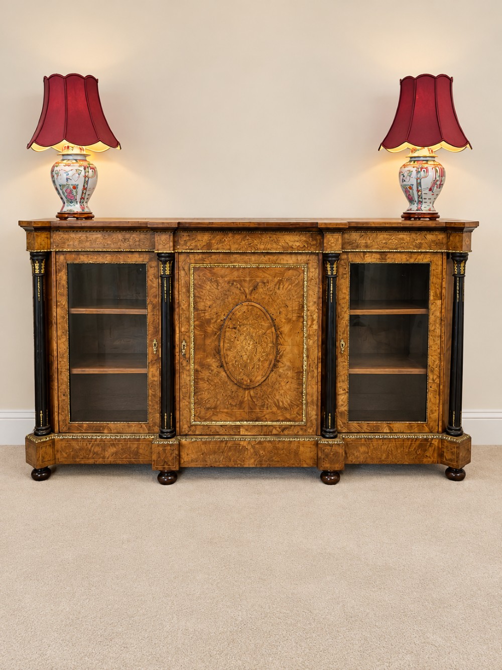 A 19th-century burr walnut credenza with a central marquetry-inlaid door flanked by two glass-front display cabinets and ebonised columns with gilt metal mounts. View III