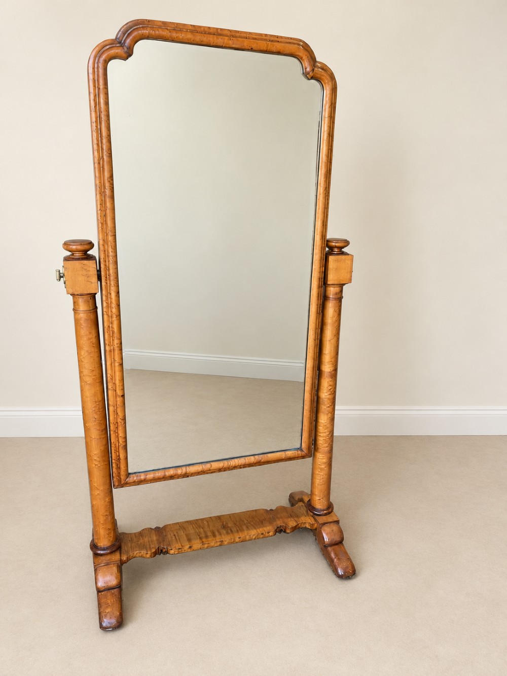 A 19th-century full-length satin birch cheval mirror featuring an arched top frame supported by turned upright pillars on splayed legs. View III