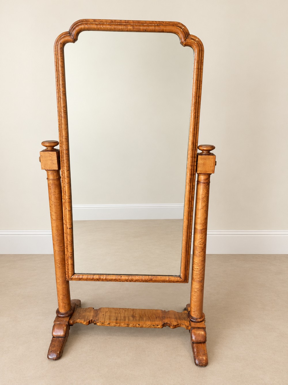 A 19th-century full-length satin birch cheval mirror featuring an arched top frame supported by turned upright pillars on splayed legs. View IV