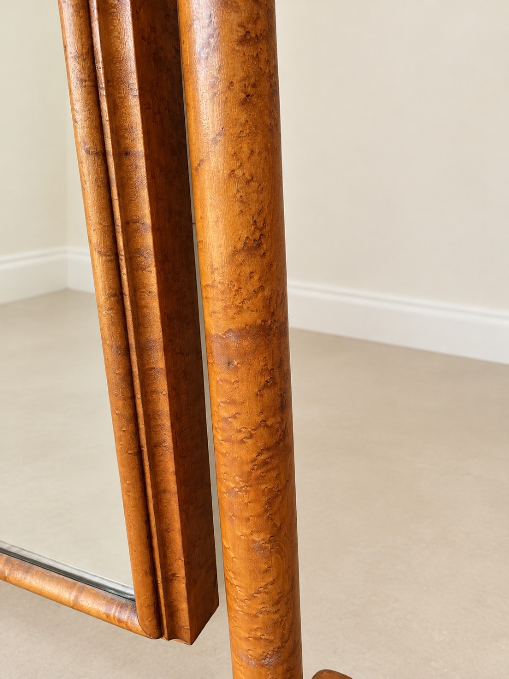 A 19th-century full-length satin birch cheval mirror featuring an arched top frame supported by turned upright pillars on splayed legs. View X