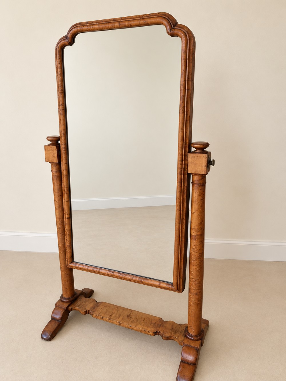A 19th-century full-length satin birch cheval mirror featuring an arched top frame supported by turned upright pillars on splayed legs. View XI