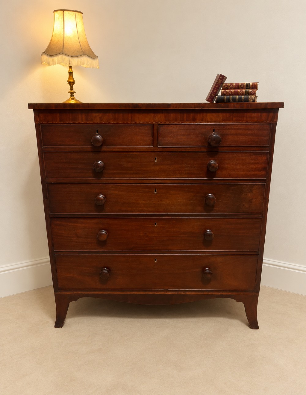 A 19th-century inlaid mahogany chest featuring two short drawers over three long drawers with turned knobs and splayed bracket feet. View III