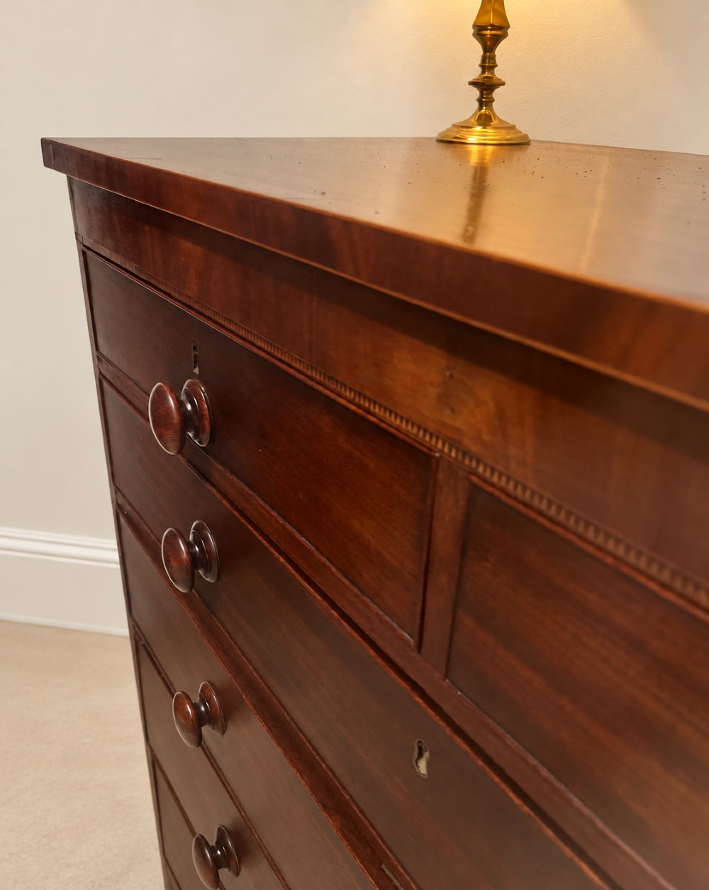 A 19th-century inlaid mahogany chest featuring two short drawers over three long drawers with turned knobs and splayed bracket feet. View VI