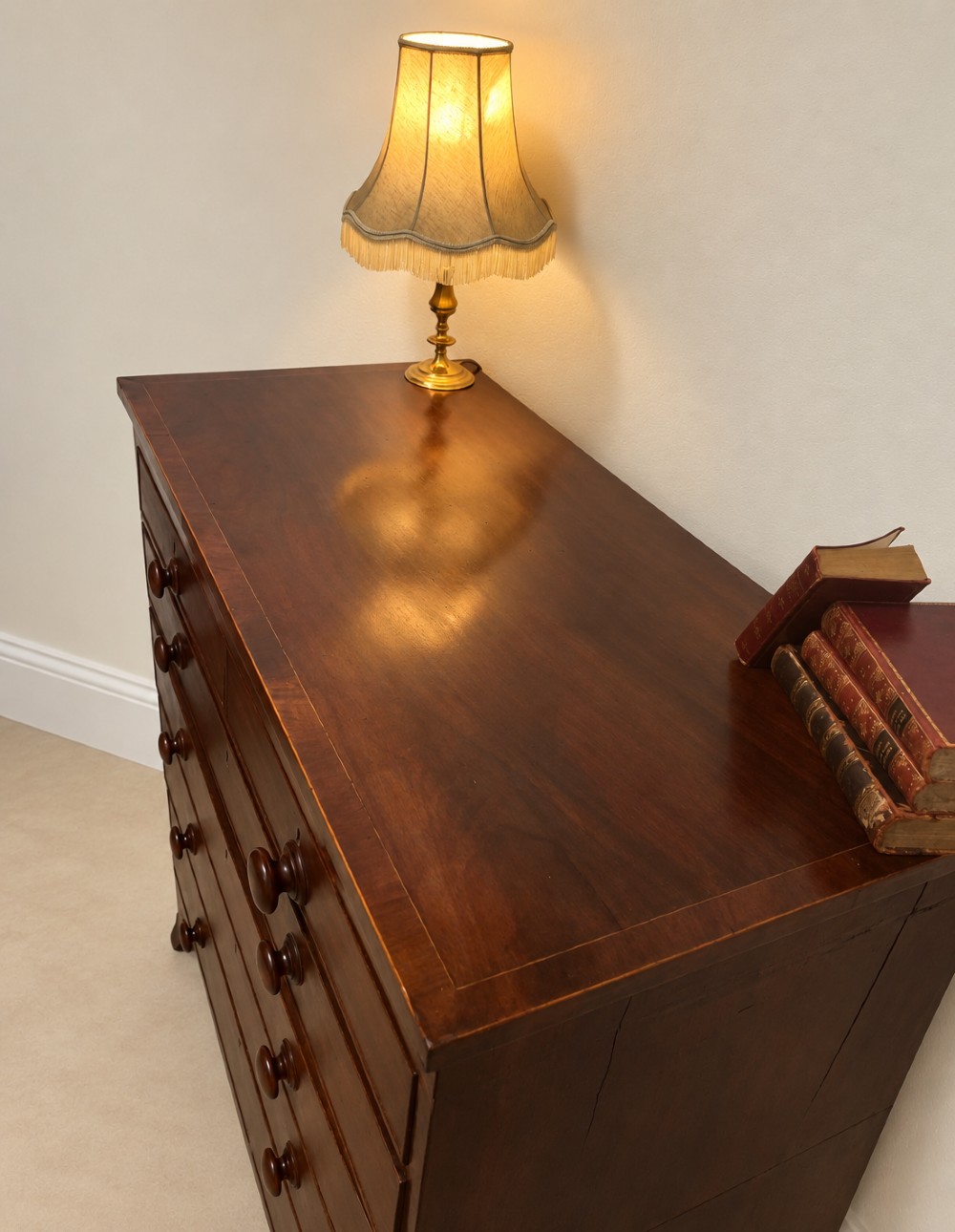 A 19th-century inlaid mahogany chest featuring two short drawers over three long drawers with turned knobs and splayed bracket feet. View VII