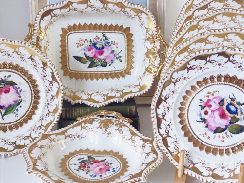 fig 1. An eight-piece Regency Grainger Lee & Co porcelain dessert service with gold leaf borders and hand-painted floral centres against a white ground.
