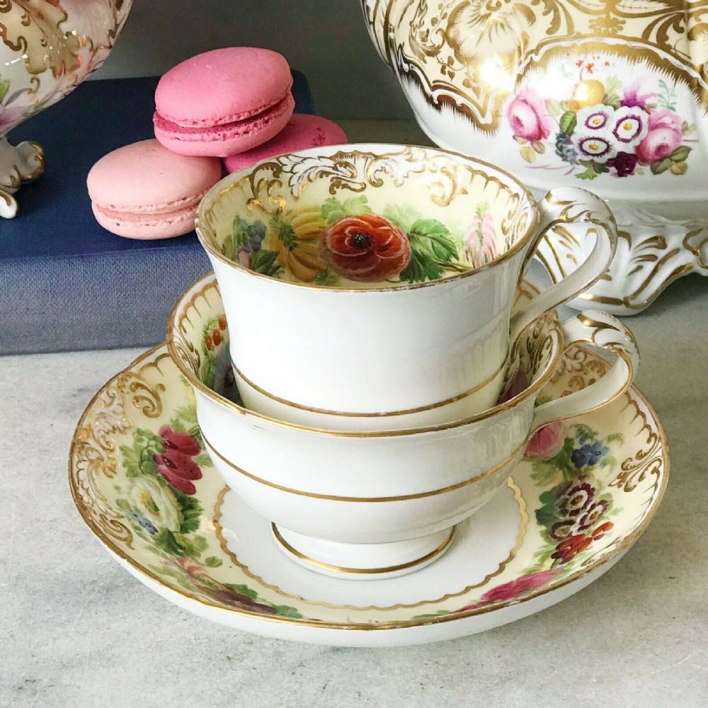 An antique Copeland true trio decorated with handpainted flowers
