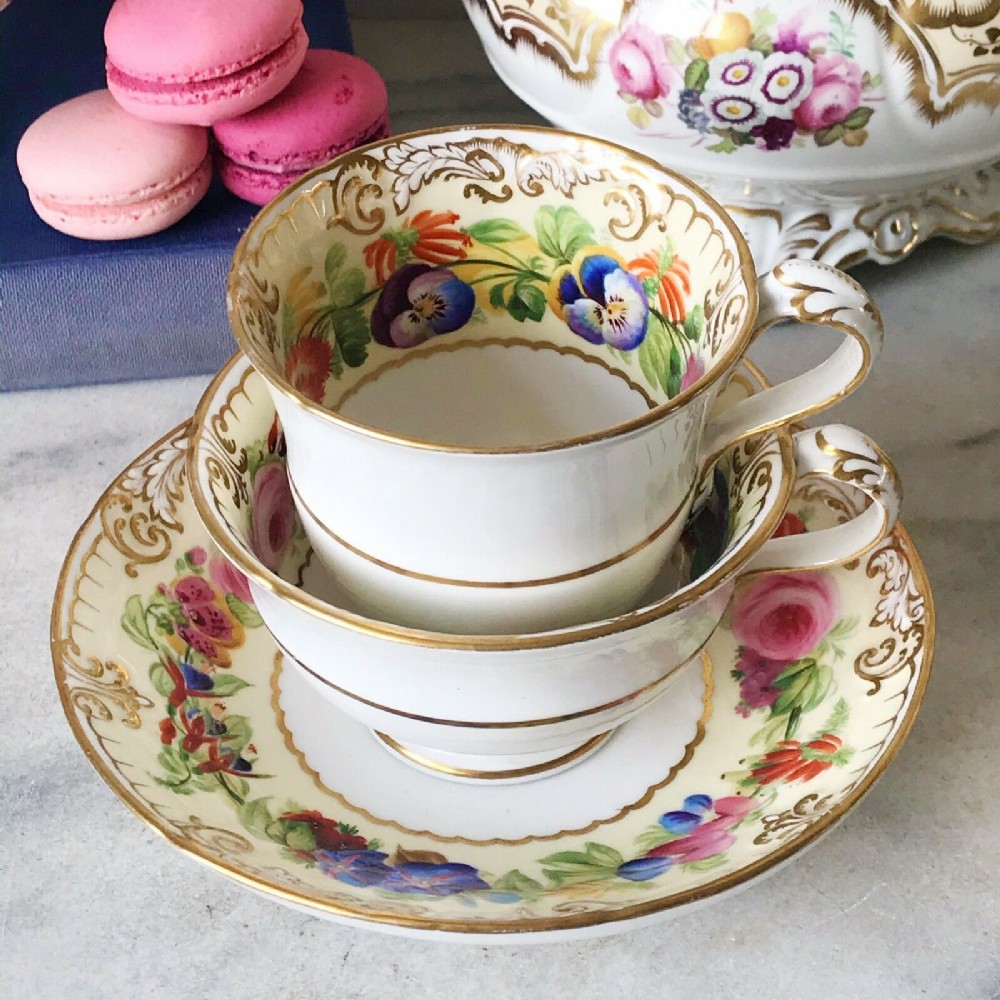An antique Copeland true trio decorated with handpainted flowers