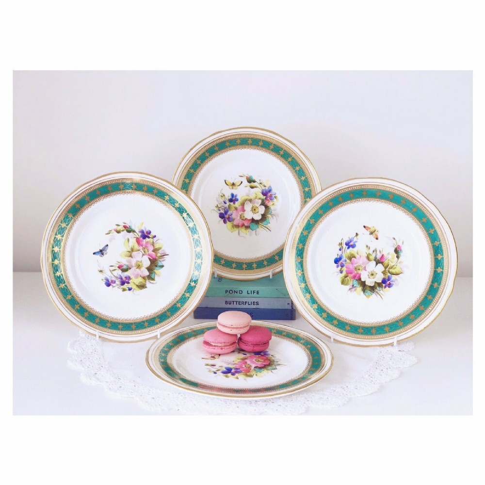 Antique porcelain set of 4 plates with handpainted butterflies and flowers
