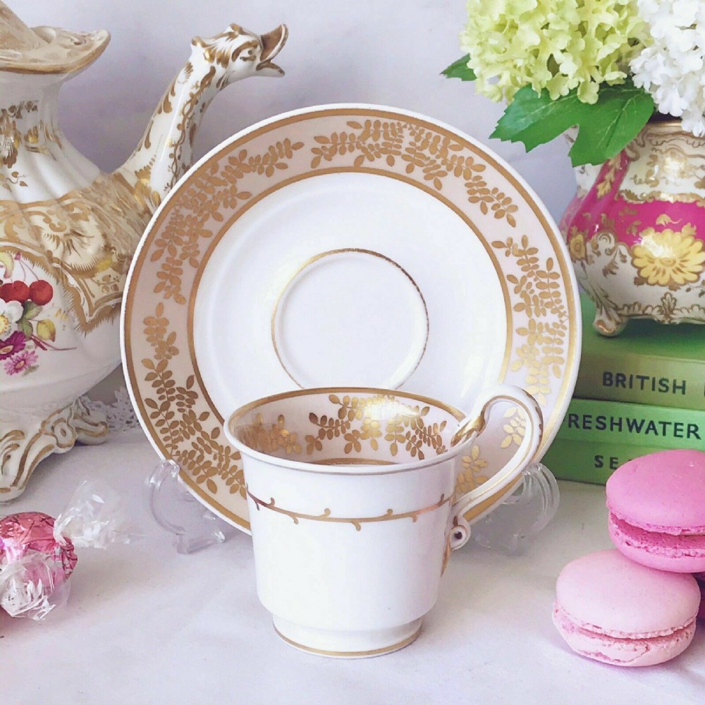 Antique Spode Estruscan serpent handle cup and saucer, circa 1820, gilt decor.