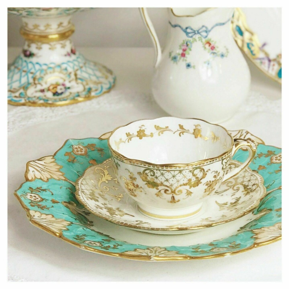 Antique Ridgway foliage shape teacup and saucer duo, gilt pattern
