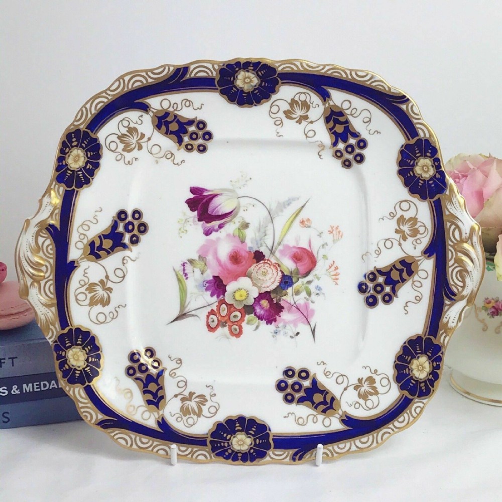 A Samuel Alcock cake plate with handpainted flowers