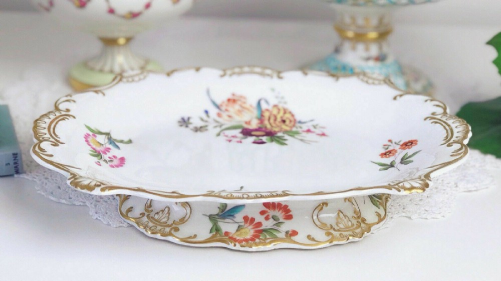 An antique Minton low comport footed dish decorated with handpainted flowers