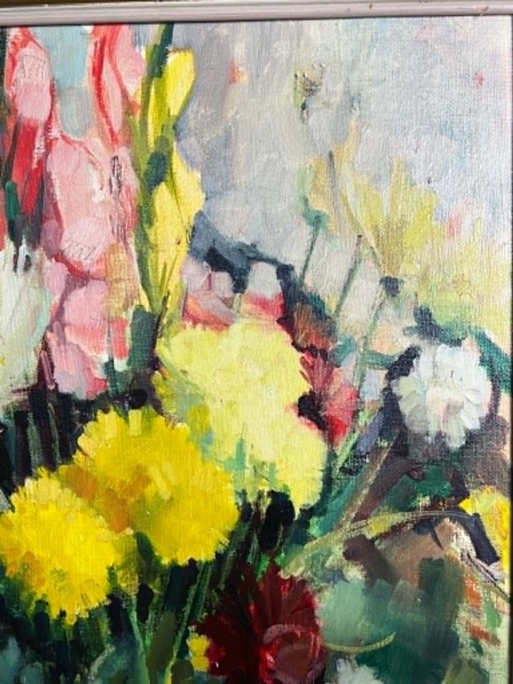 A framed mid-century oil on board painting featuring a colourful floral still life composition with yellow, pink, and green tones set within a wooden frame. View II