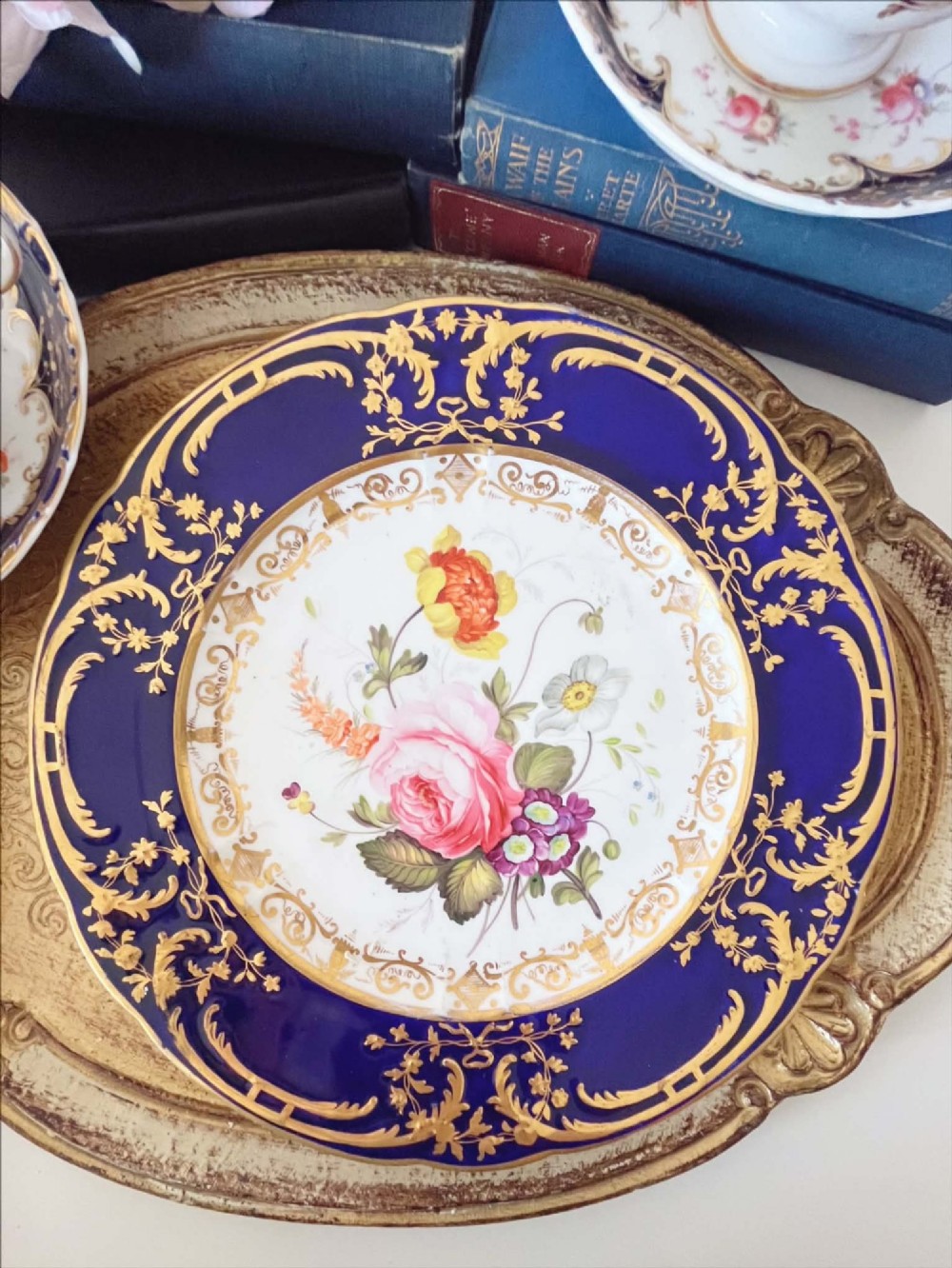 Antique Coalport dessert plate with handpainted rose & other flowers against a cobalt ground, c.1820