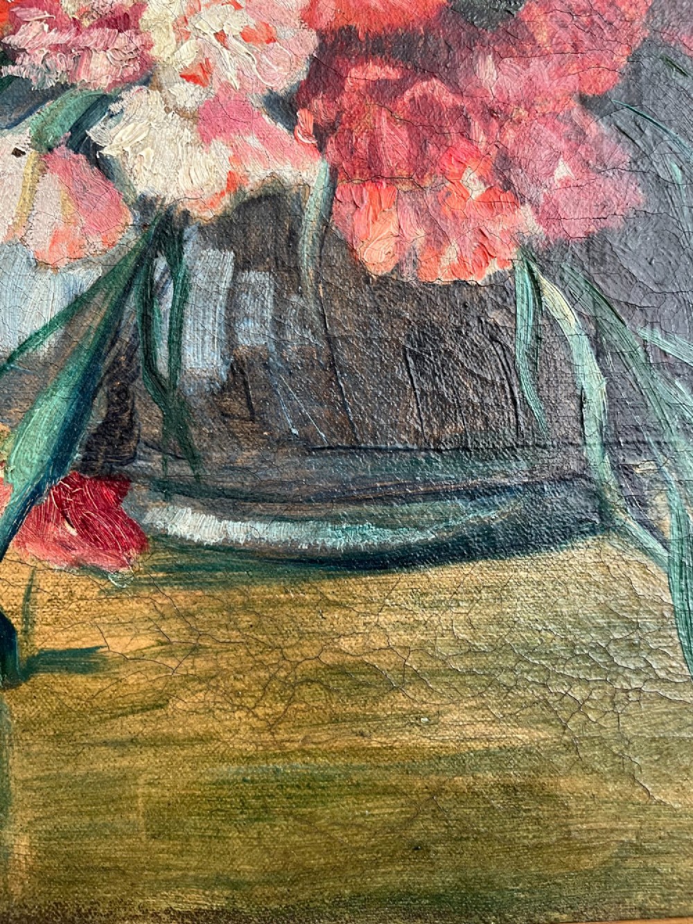 A horizontal oil painting depicting a bouquet of red, pink, yellow, and white carnations in a dark vase, enclosed within a moulded gilt frame. View IV