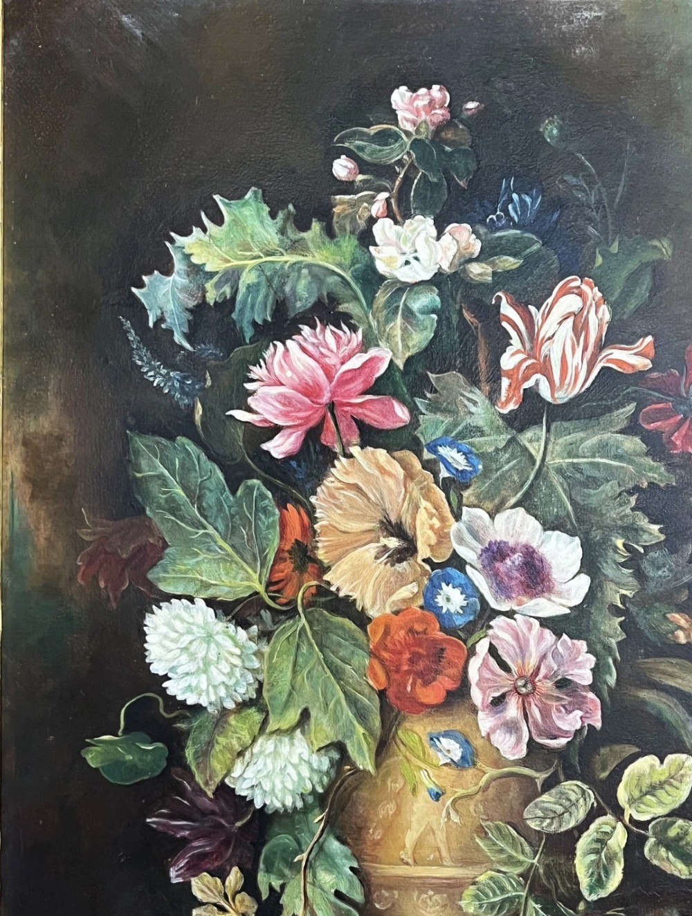 A framed oil painting depicting a floral arrangement in a urn with fruit at the base, housed within an ornate gilt gesso frame. View VIII