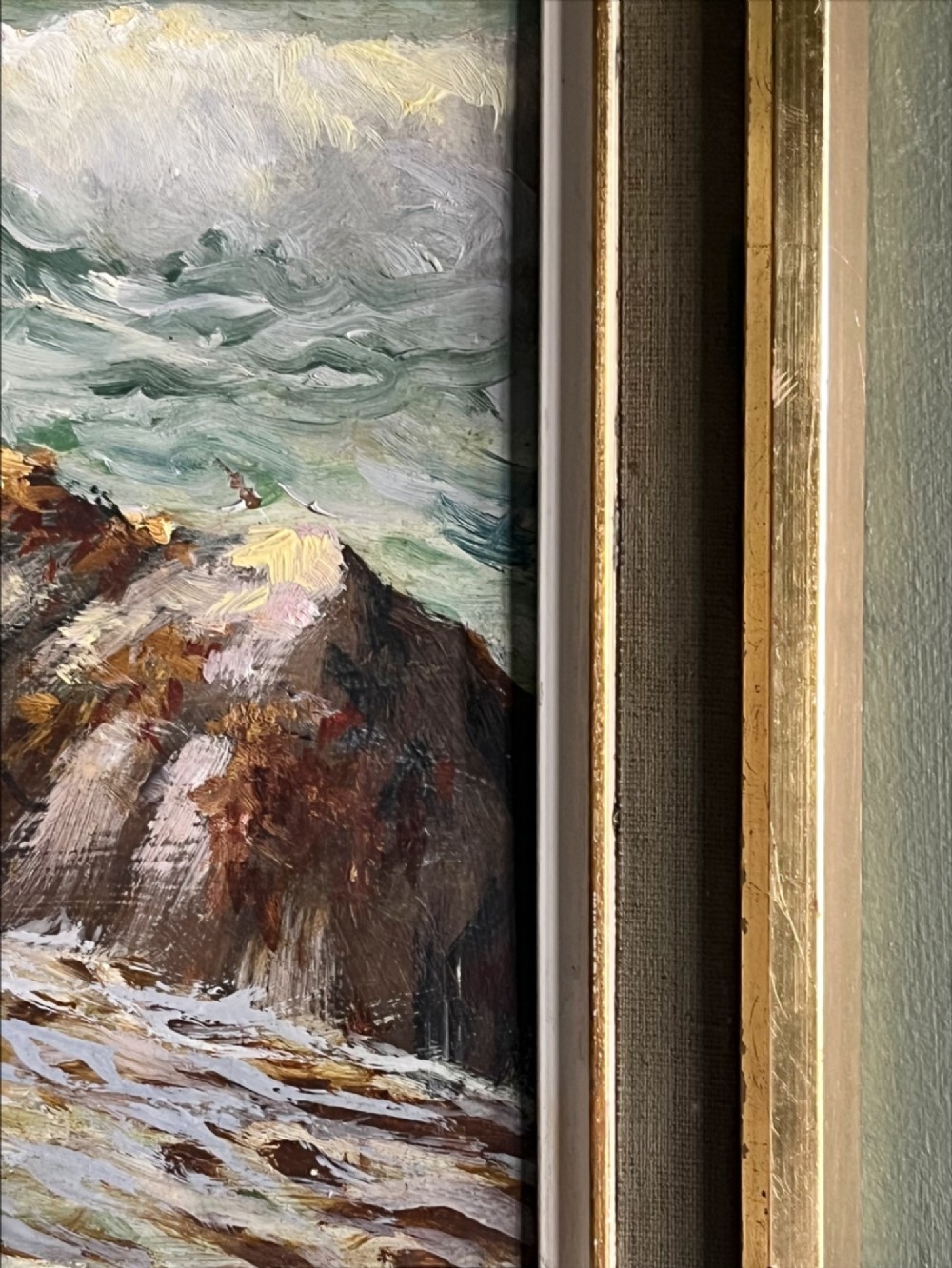 A framed oil painting depicting crashing ocean waves against coastal rocks under an overcast sky, signed by artist Sidney A. Court. View V