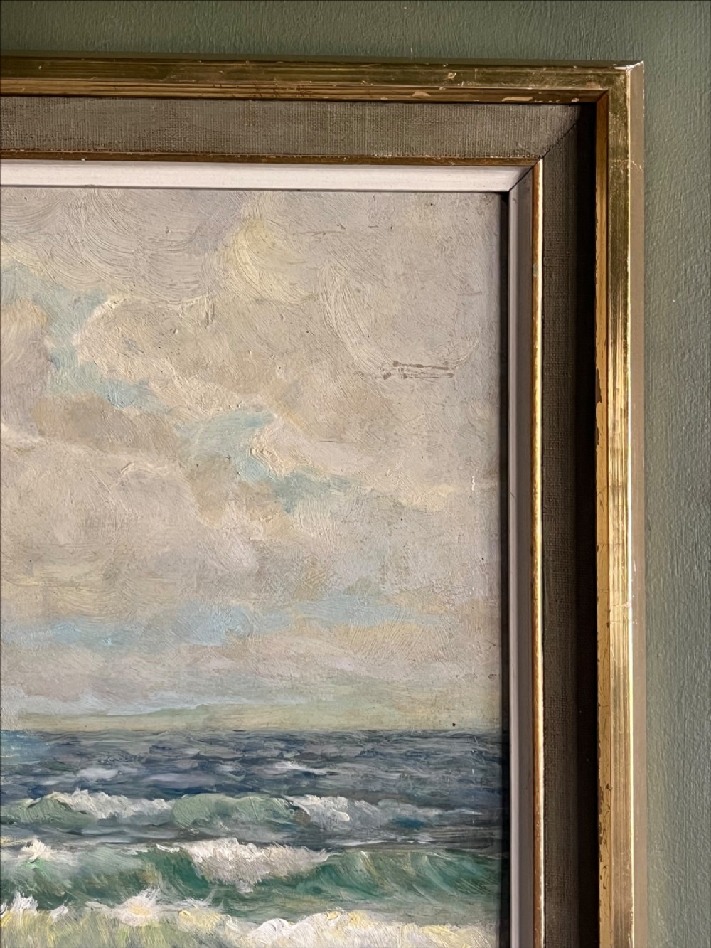 A framed oil painting depicting crashing ocean waves against coastal rocks under an overcast sky, signed by artist Sidney A. Court. View VI
