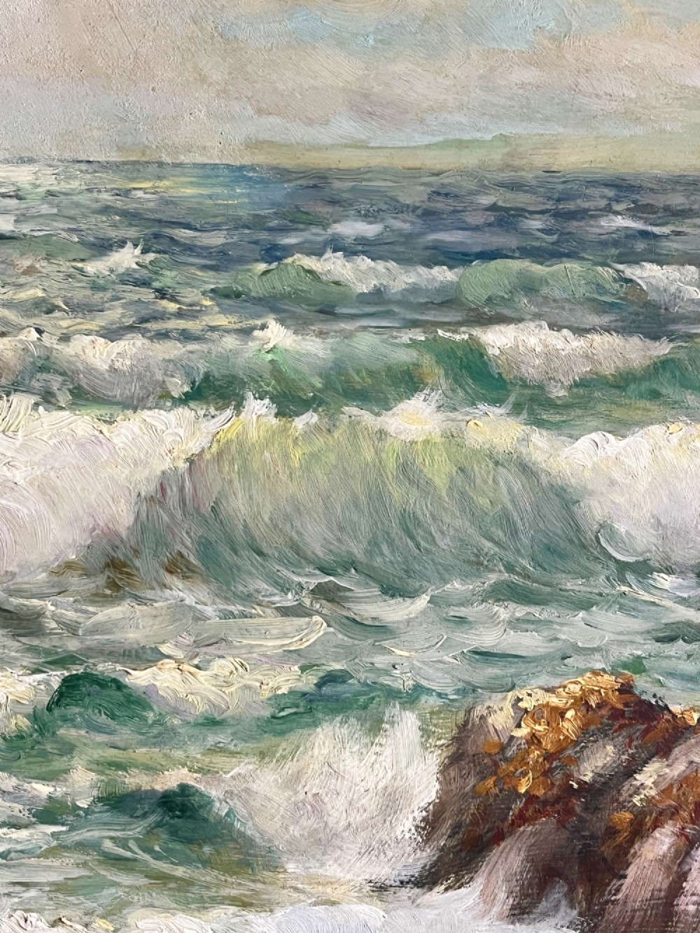 A framed oil painting depicting crashing ocean waves against coastal rocks under an overcast sky, signed by artist Sidney A. Court. View XI