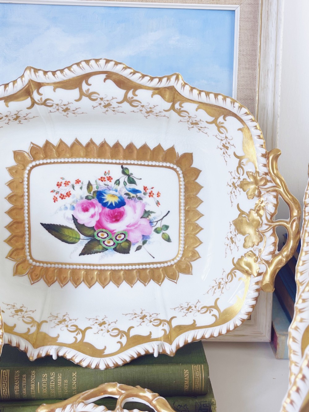 An eight-piece Regency Grainger Lee & Co porcelain dessert service with gold leaf borders and hand-painted floral centres against a white ground. View VI