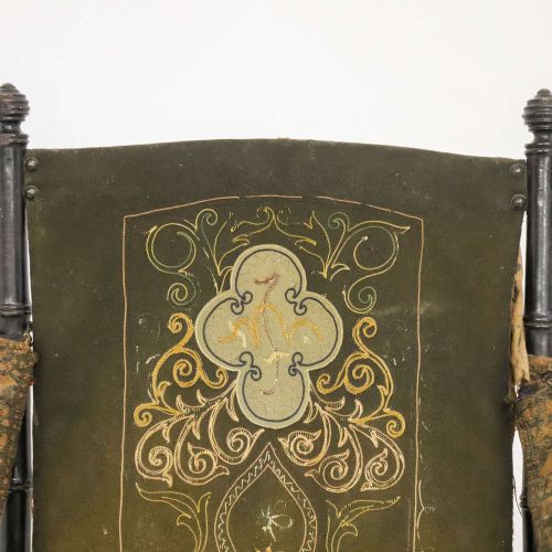 fig 5. A 19th-century French Louis Philippe folding campaign chair featuring an ebonised faux-bamboo frame and an embroidered dark green fabric sling back and seat.