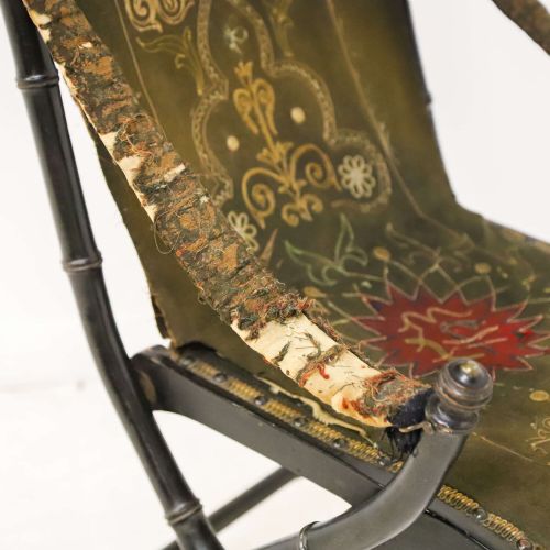 fig 8. A 19th-century French Louis Philippe folding campaign chair featuring an ebonised faux-bamboo frame and an embroidered dark green fabric sling back and seat.