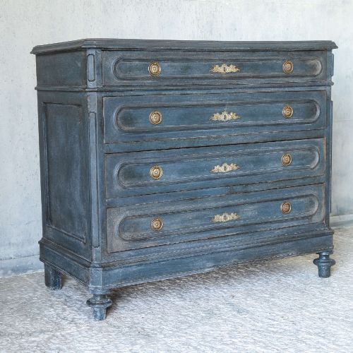 fig 3. A late 19th-century French Louis XVI Revival chest of drawers painted in slate blue with four drawers featuring decorative brass hardware.