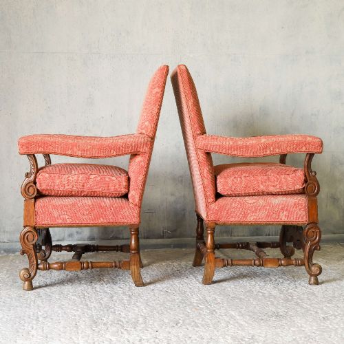fig 5. A pair of late nineteenth-century French Renaissance Revival oak armchairs upholstered in terracotta patterned fabric with carved scrolled stretchers and turned legs.