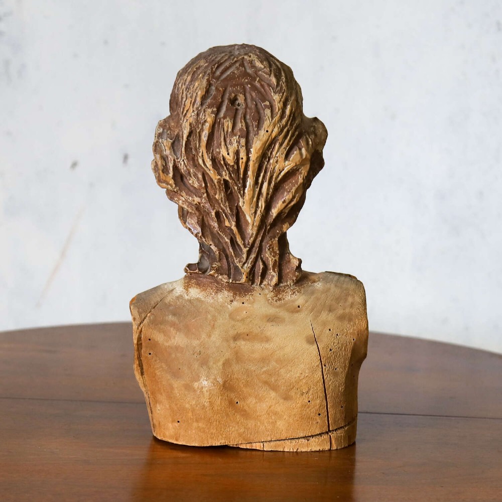 An 18th-century carved olive wood bust depicting Christ with visible traces of original polychrome paint. View VII