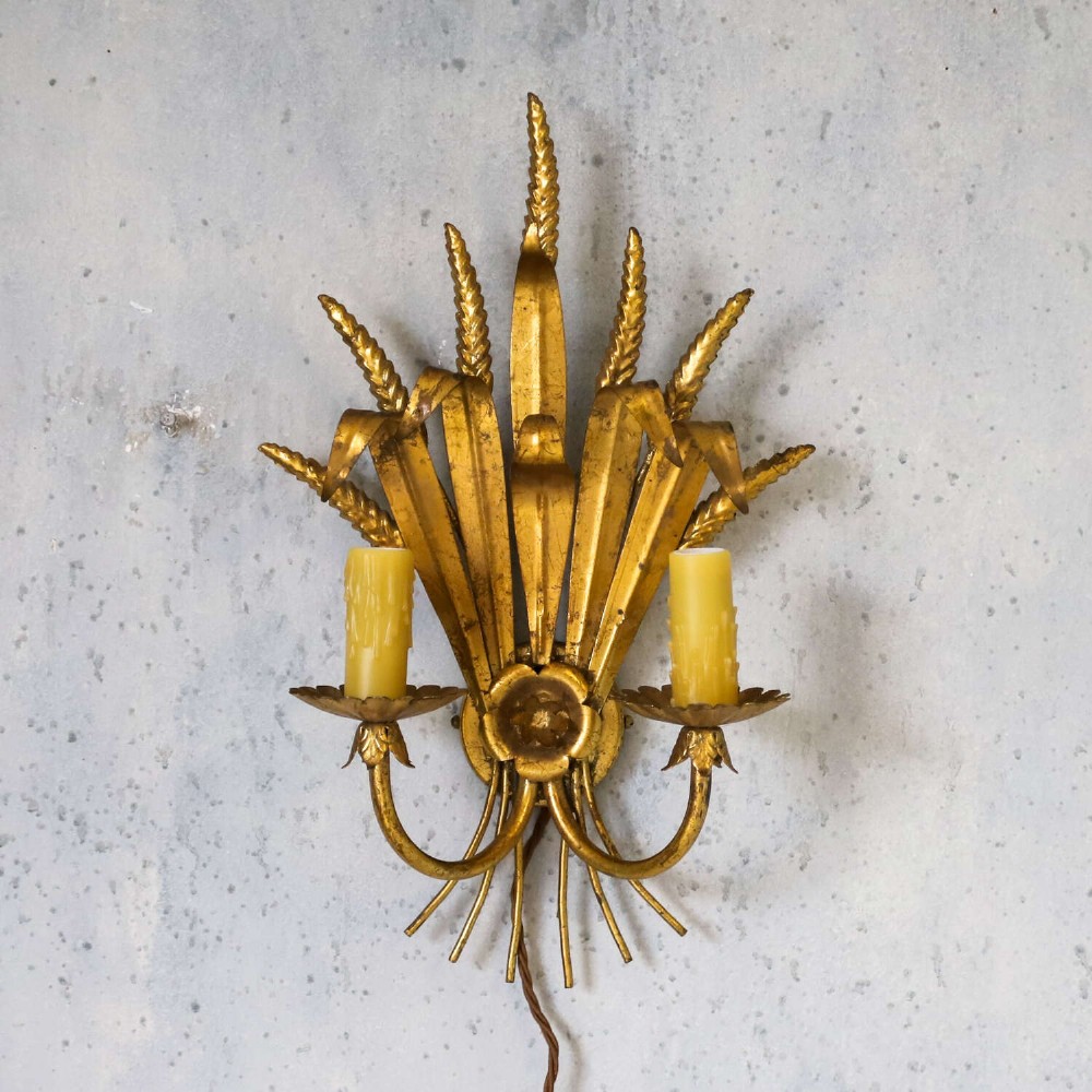 A mid-century gilt metal wall sconce crafted in the form of a wheat sheaf with two candle arms. View II
