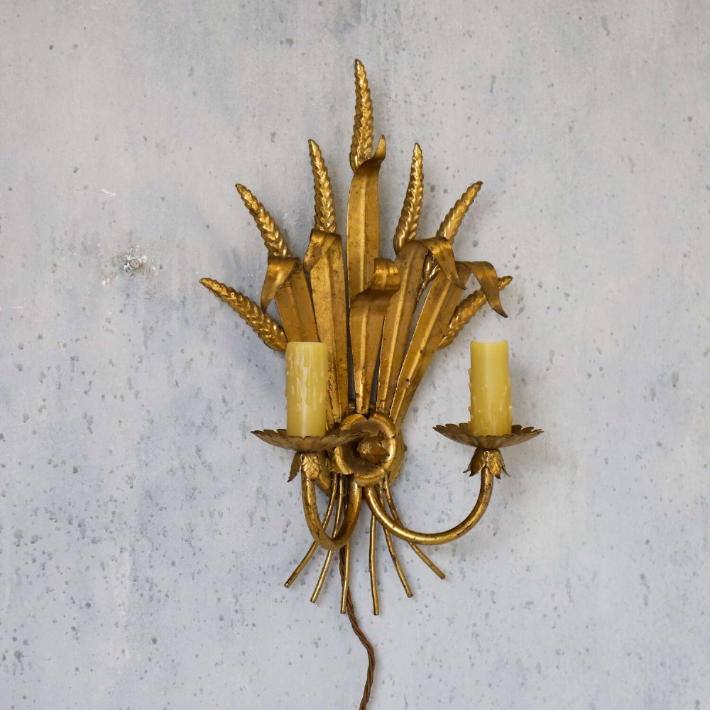 A mid-century gilt metal wall sconce crafted in the form of a wheat sheaf with two candle arms. View III