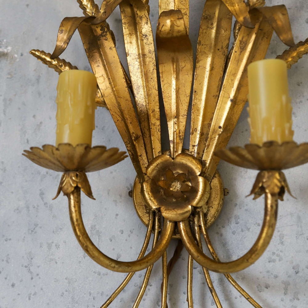 A mid-century gilt metal wall sconce crafted in the form of a wheat sheaf with two candle arms. View V