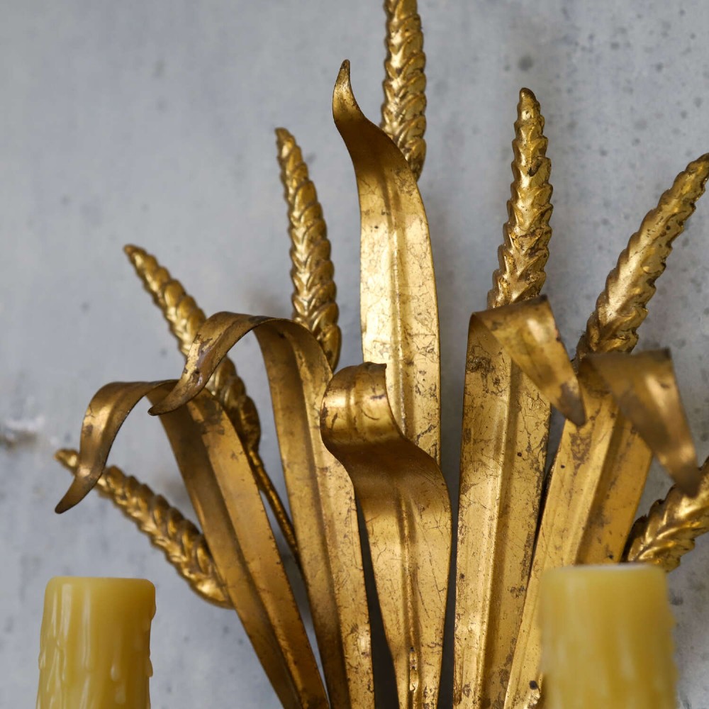 A mid-century gilt metal wall sconce crafted in the form of a wheat sheaf with two candle arms. View VII