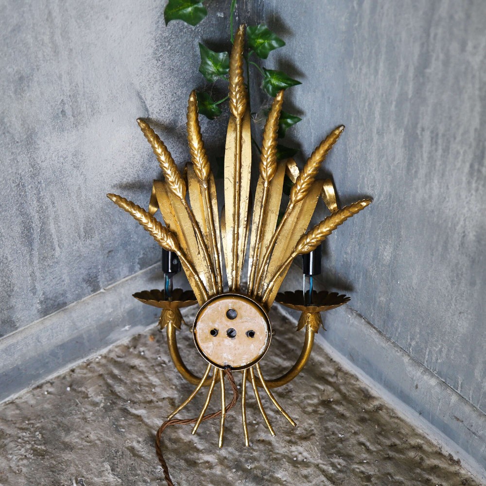 A mid-century gilt metal wall sconce crafted in the form of a wheat sheaf with two candle arms. View XI