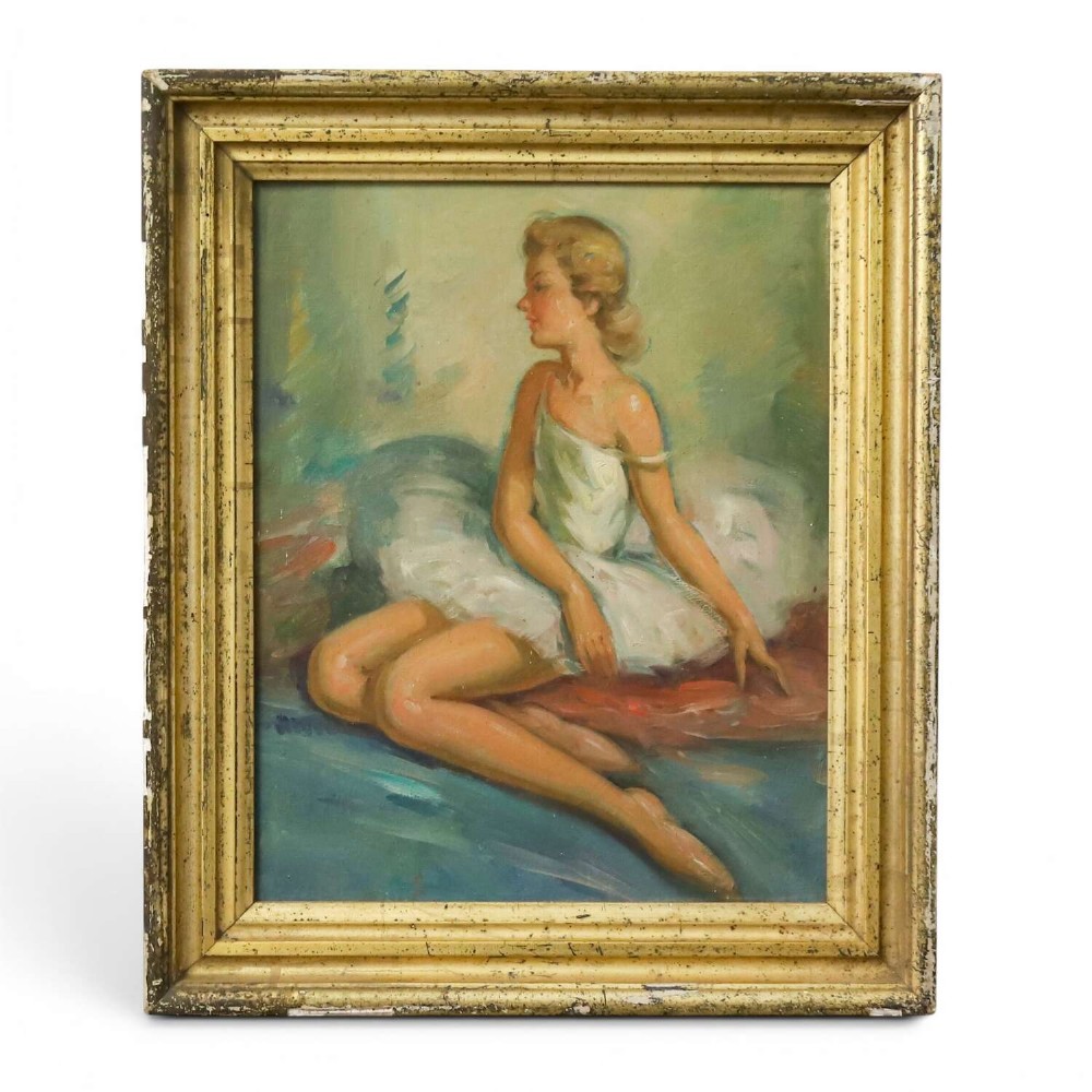 A mid-20th-century oil painting depicting a seated ballerina in a white tutu, housed within a distressed gold gilt wooden frame.
