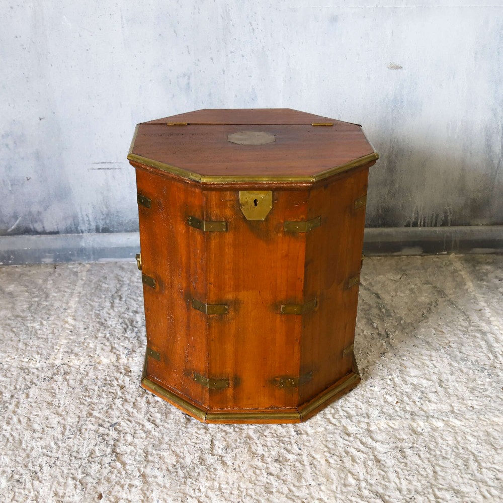 An octagonal antique wooden campaign chest featuring a hinged lift-up top, brass corner brackets, strapwork, and side carrying handles against a white background. View II