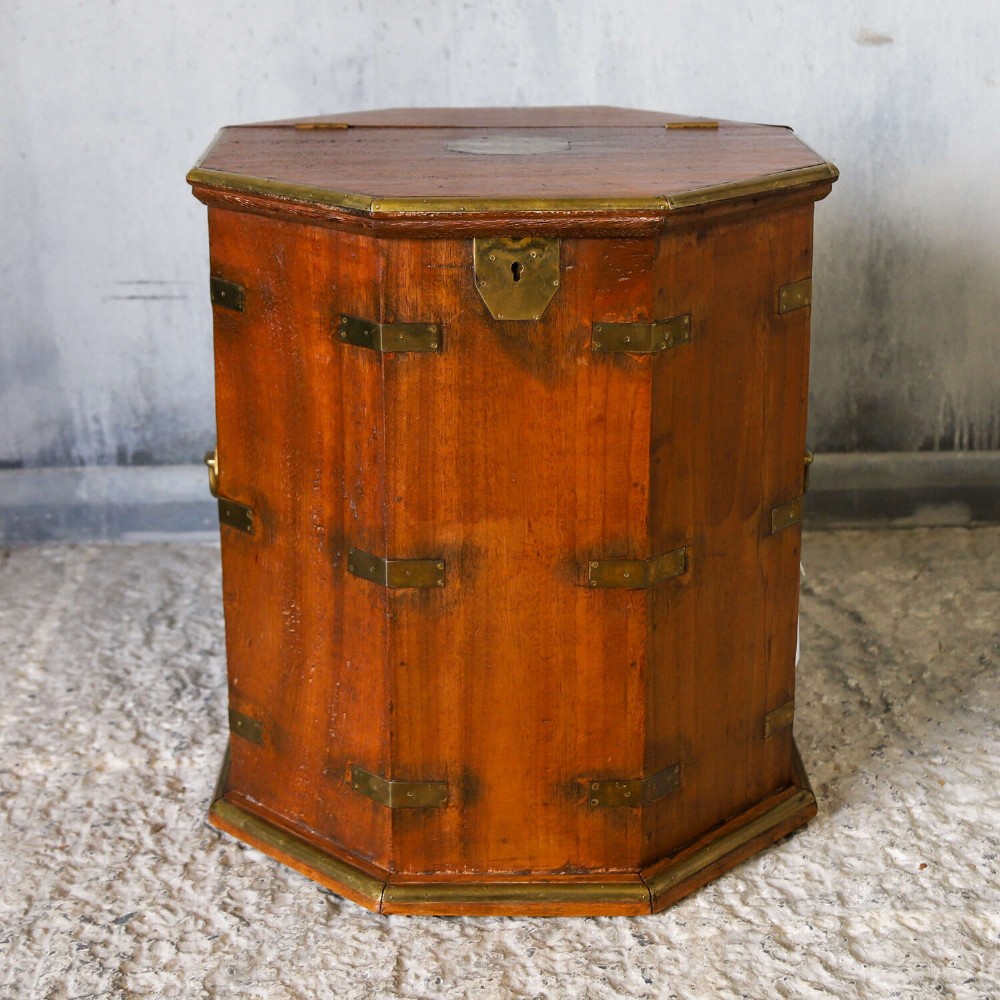 An octagonal antique wooden campaign chest featuring a hinged lift-up top, brass corner brackets, strapwork, and side carrying handles against a white background. View III