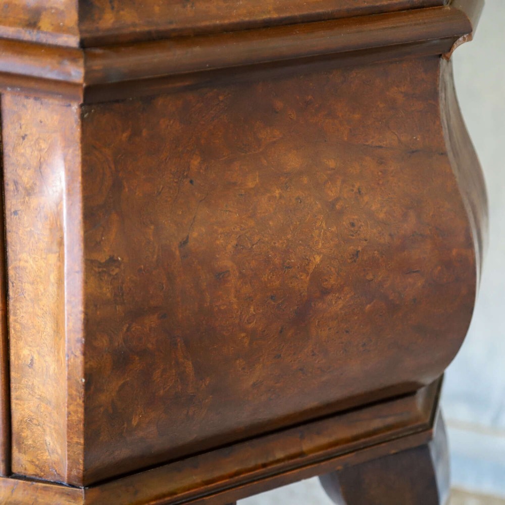 A Dutch walnut-veneered glazed cabinet featuring an arched top, glass paned upper doors, a shaped lower drawer section, and cabriole legs with claw and ball feet. View XIII