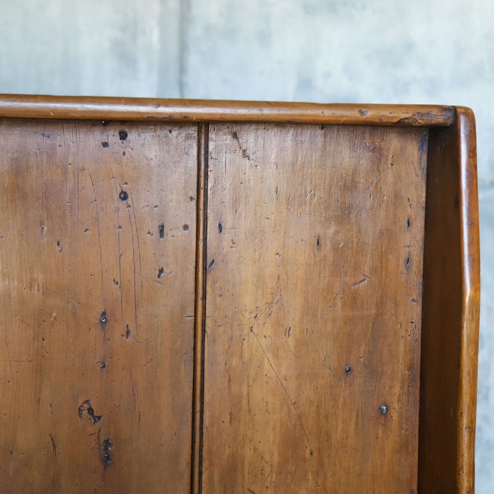 A 19th-century English country pine high-back settle bench with vertical timber panels and a warm honey brown finish. View VII