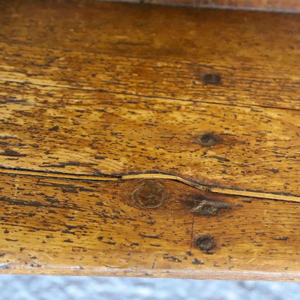 A 19th-century English country pine high-back settle bench with vertical timber panels and a warm honey brown finish. View VIII