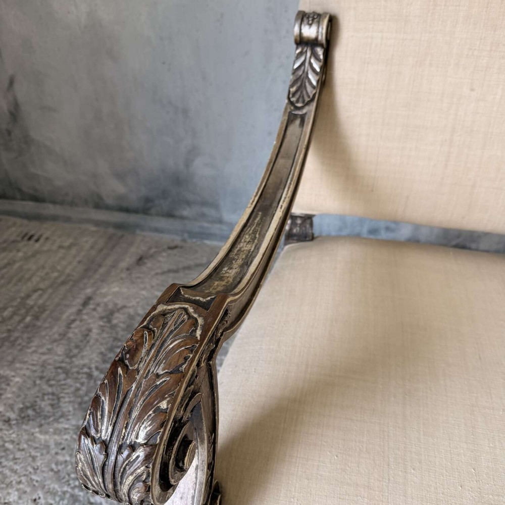 A pair of 19th-century Baroque-style throne armchairs featuring carved giltwood frames and neutral linen upholstery. View VI