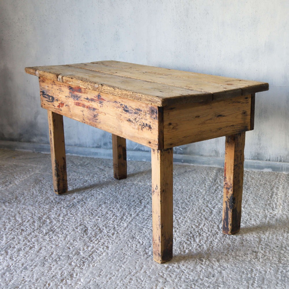 A rustic early twentieth-century Welsh pine work table featuring a thick timber plank top, deep apron, and simple straight square legs with a distressed finish. View IX
