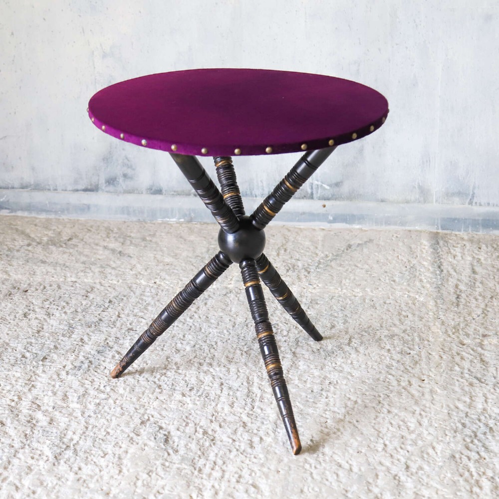 A Napoleon III armchair and matching Aesthetic Movement gypsy table upholstered in purple velvet with ebonised turned legs. View III