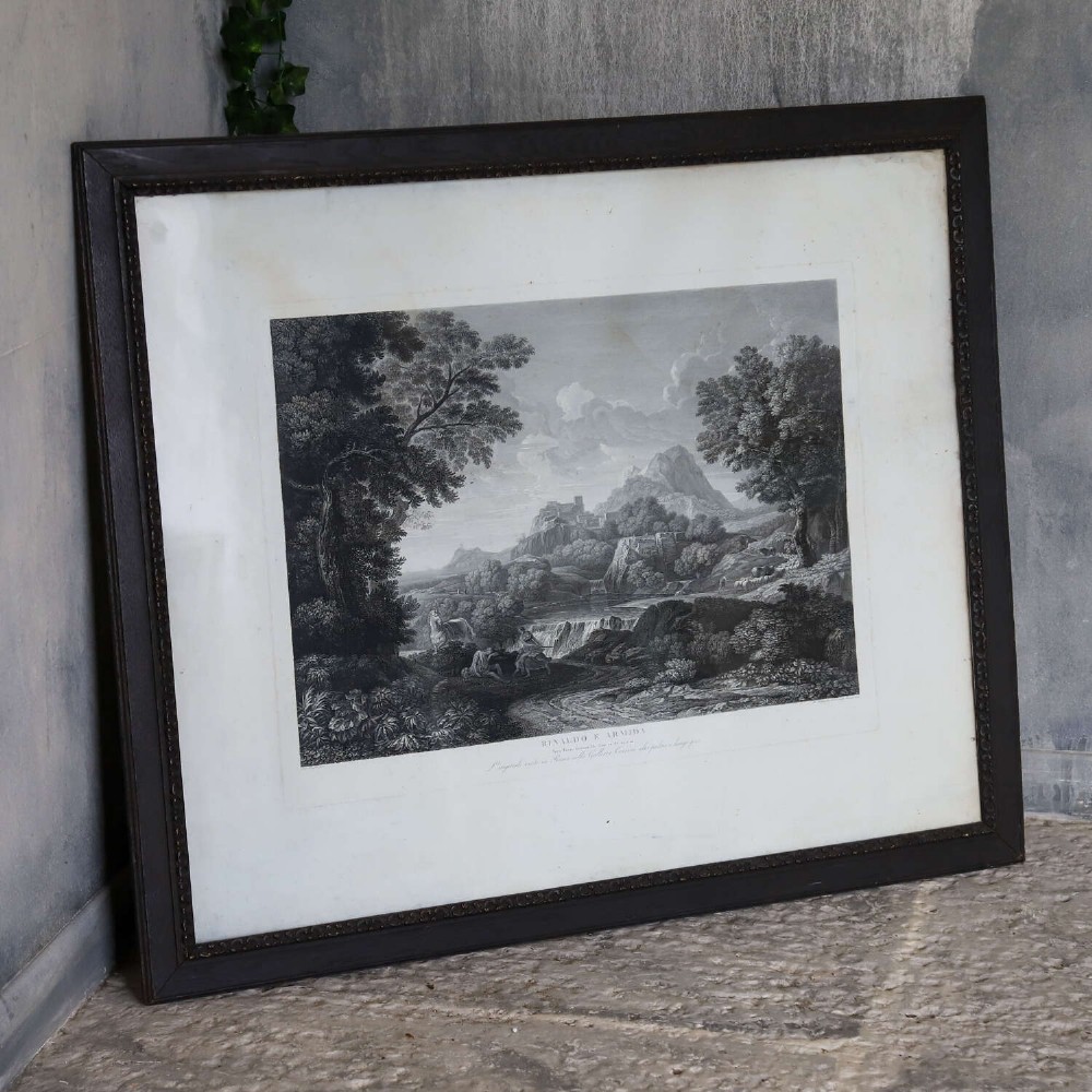 An 18th-century monochrome landscape engraving entitled Rinaldo e Armida, displayed within a wide mount and dark wooden frame. View XI